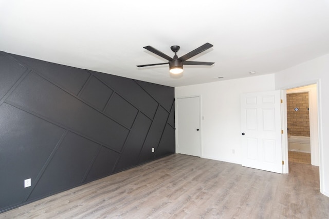 unfurnished bedroom featuring ceiling fan and light hardwood / wood-style flooring