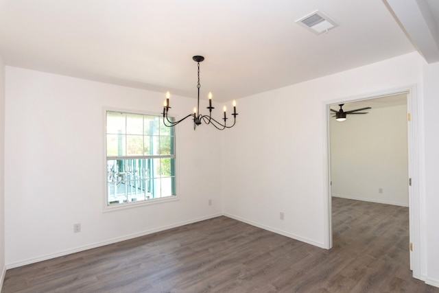 unfurnished room with ceiling fan with notable chandelier and dark wood-type flooring