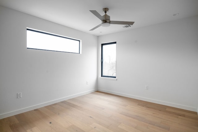 spare room featuring ceiling fan and light wood-type flooring