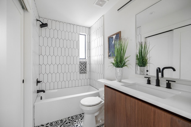 full bathroom featuring vanity, toilet, and tiled shower / bath