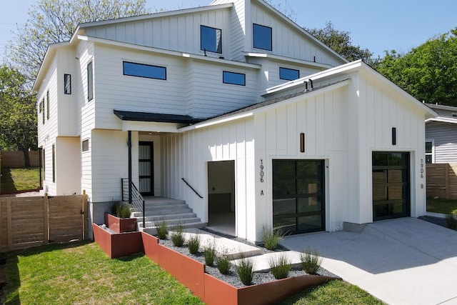 rear view of property with a garage