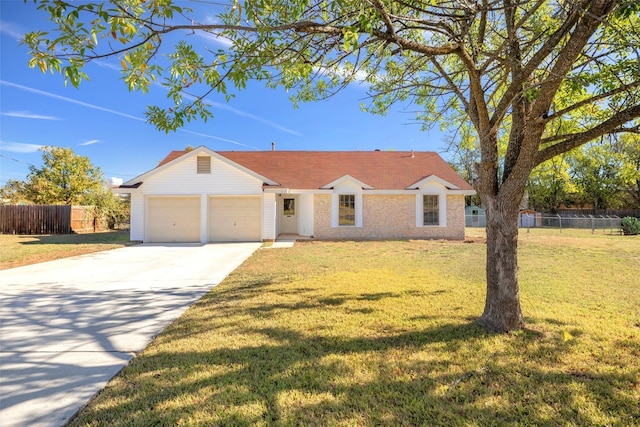 ranch-style home featuring a front yard and a garage