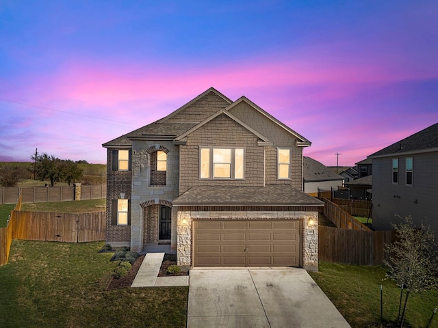 view of front of property with a lawn and a garage