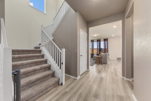 staircase featuring hardwood / wood-style flooring