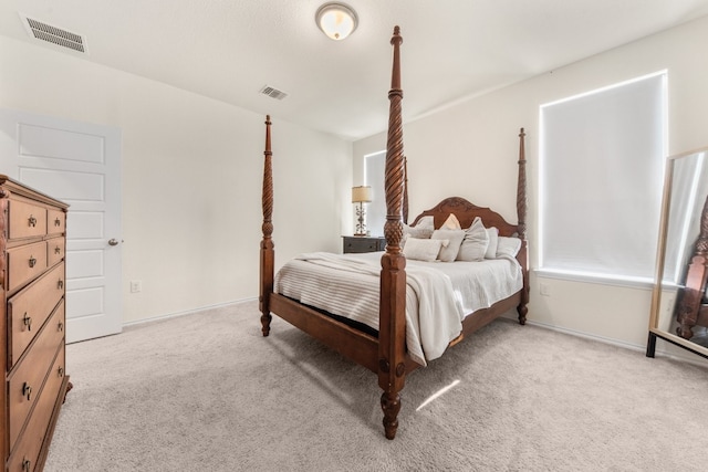 bedroom with light colored carpet