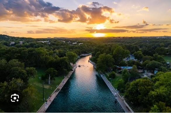 aerial view at dusk with a water view