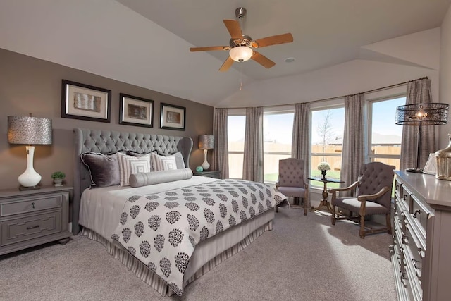 bedroom featuring ceiling fan, light colored carpet, and lofted ceiling