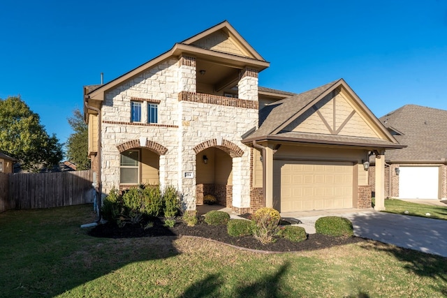 view of front of property featuring a garage and a front lawn