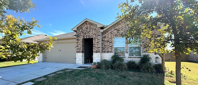 view of front of home with a garage and a front lawn