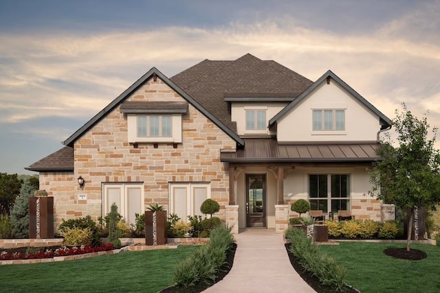 view of front of house with a yard