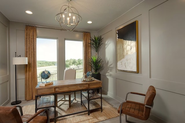 office area featuring a chandelier and light hardwood / wood-style floors