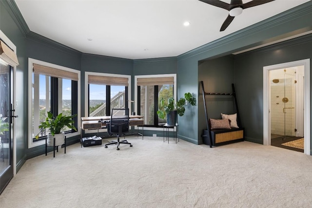 sitting room with carpet, a mountain view, ceiling fan, and ornamental molding