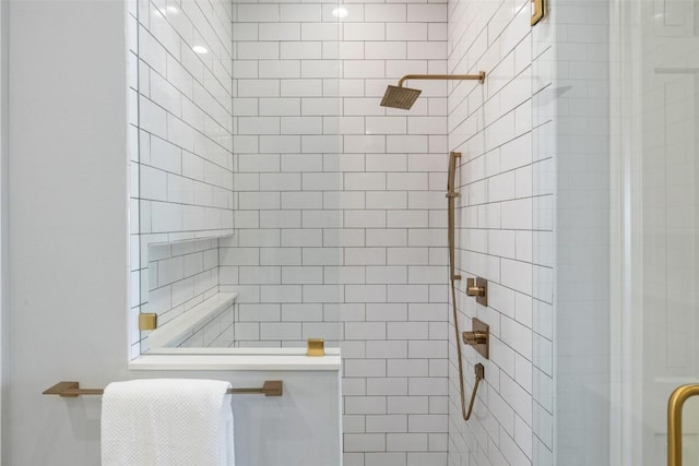 bathroom featuring a shower with door