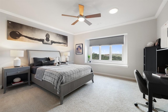 carpeted bedroom with ceiling fan and ornamental molding