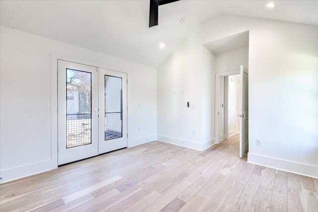 2618 E 4th St, Austin, TX 78702 - empty room featuring french doors, vaulted ceiling, light wood finished floors, baseboards, and recessed lighting