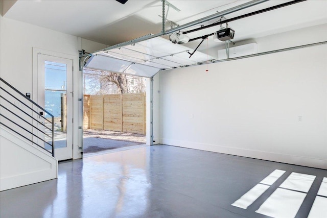 2618 E 4th St, Austin, TX 78702 - garage with a garage door opener and baseboards
