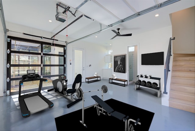 gym with a garage and recessed lighting