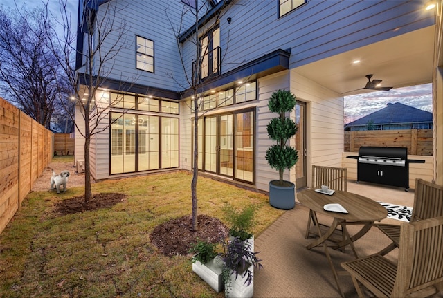 exterior space featuring grilling area and a fenced backyard