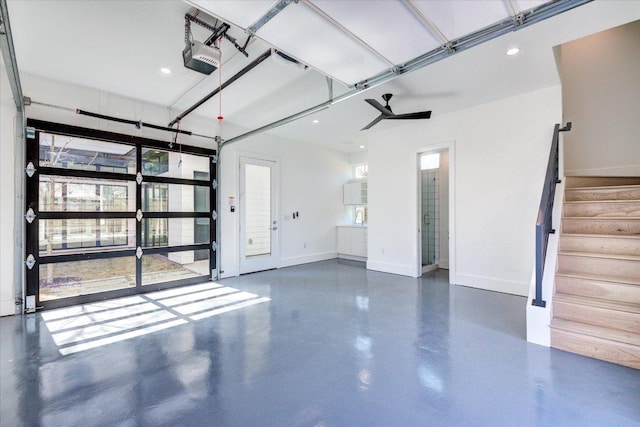 2618 E 4th St, Austin, TX 78702 - garage featuring baseboards, recessed lighting, a ceiling fan, and a garage door opener