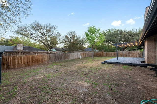 view of yard featuring a wooden deck