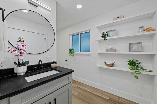 bathroom featuring hardwood / wood-style floors and vanity