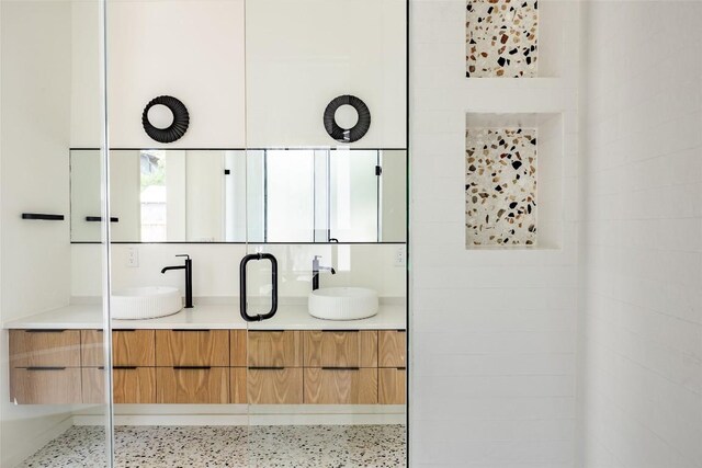 2114 Lawnmont Ave, Austin, TX 78756 - bathroom view of double vanity and speckled floor