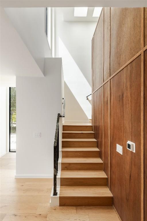 2114 Lawnmont Ave, Austin, TX 78756 - stairway featuring wood finished floors and baseboards