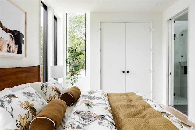 bedroom featuring hardwood / wood-style flooring and a closet