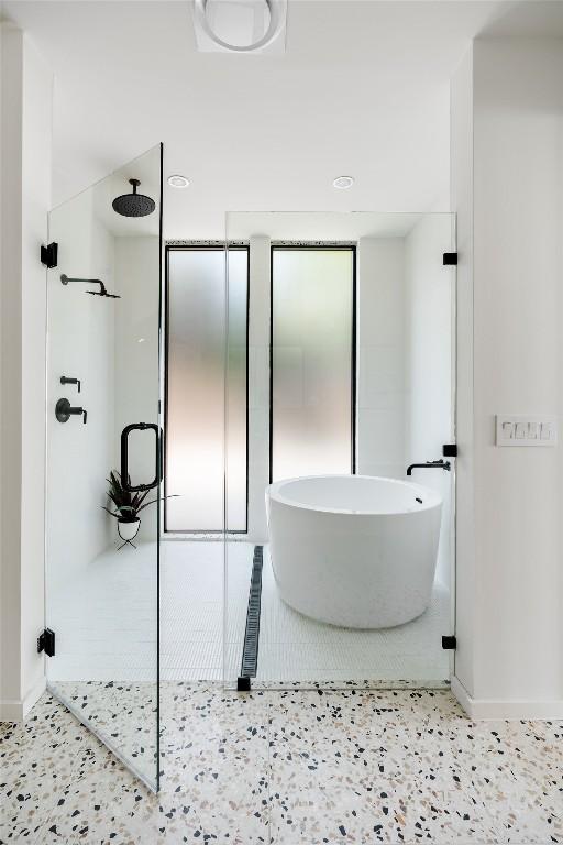 2114 Lawnmont Ave, Austin, TX 78756 - bathroom with a stall shower and a freestanding bath