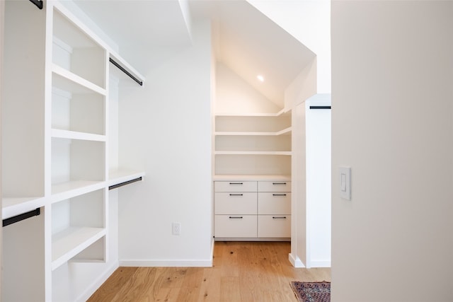 spacious closet featuring light hardwood / wood-style floors