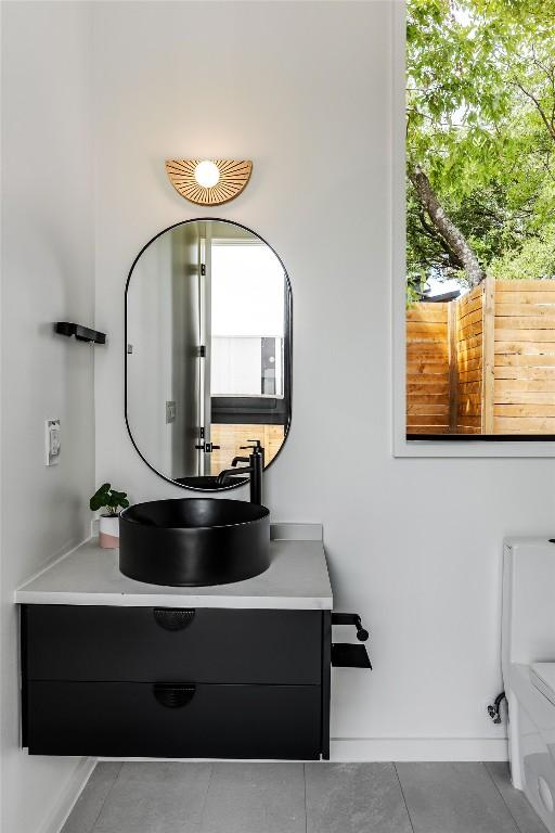 2114 Lawnmont Ave, Austin, TX 78756 - bathroom with vanity and tile patterned flooring