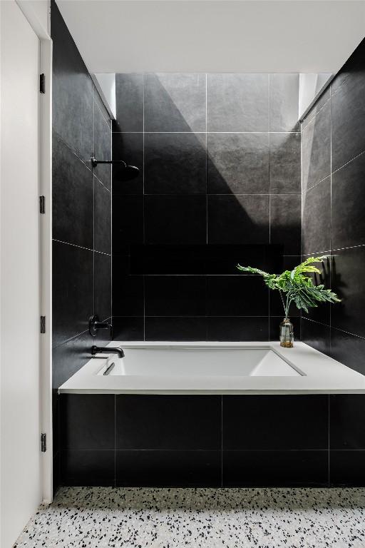 2114 Lawnmont Ave, Austin, TX 78756 - bathroom with a tub to relax in, tiled shower, and speckled floor