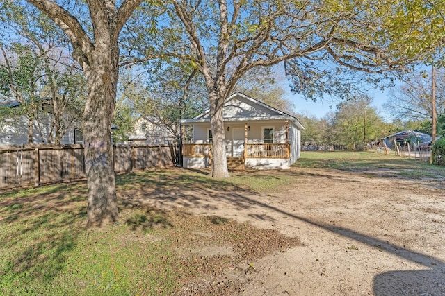 view of yard featuring covered porch