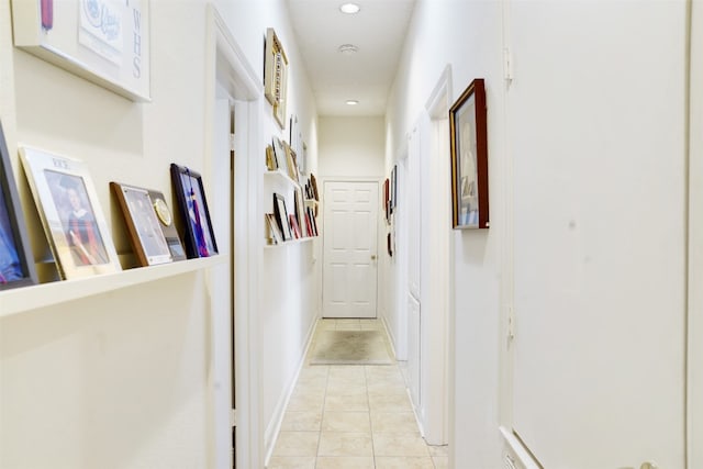 corridor featuring light tile patterned flooring