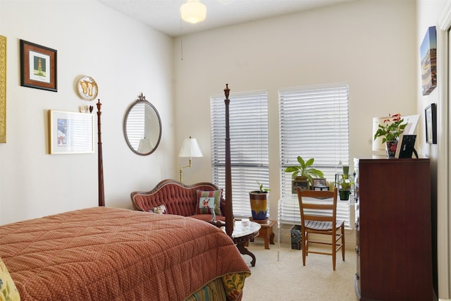 bedroom with light colored carpet