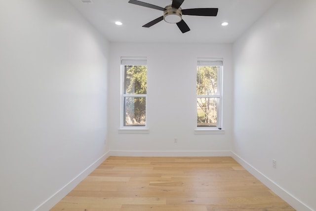 unfurnished room with ceiling fan and light hardwood / wood-style floors