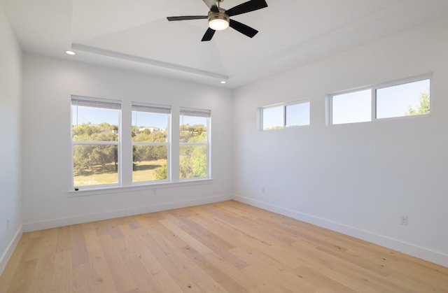 empty room with light hardwood / wood-style floors and ceiling fan