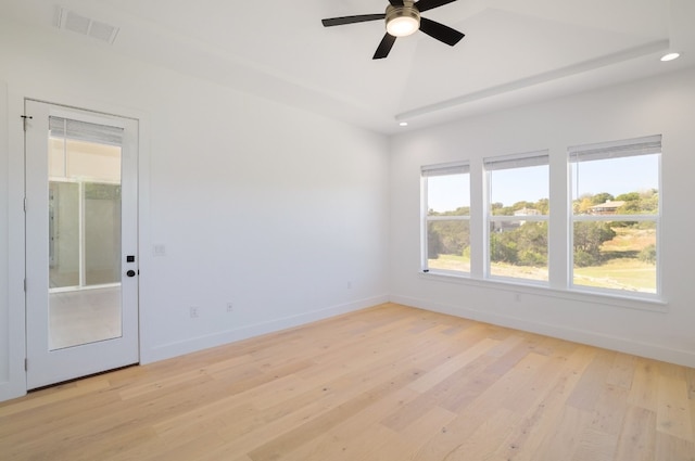 spare room featuring ceiling fan and light hardwood / wood-style floors