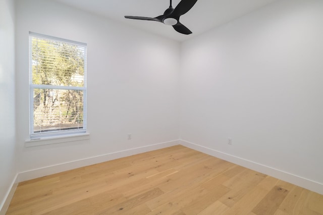 spare room featuring ceiling fan and light hardwood / wood-style flooring