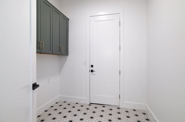 laundry room with cabinets