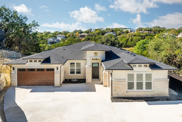 prairie-style house featuring a garage