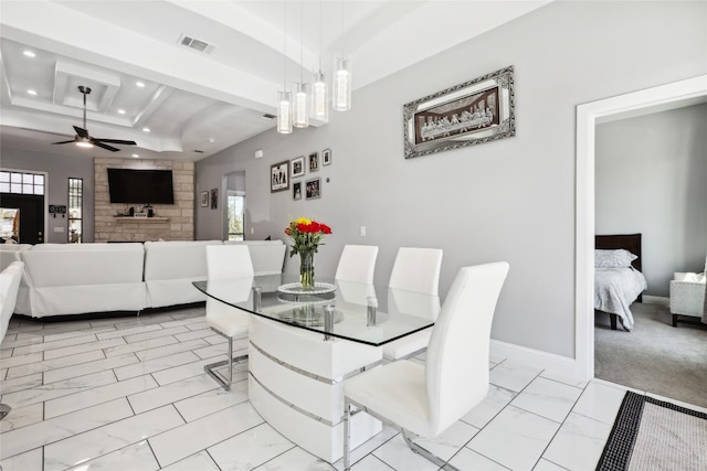 dining area with beamed ceiling and ceiling fan