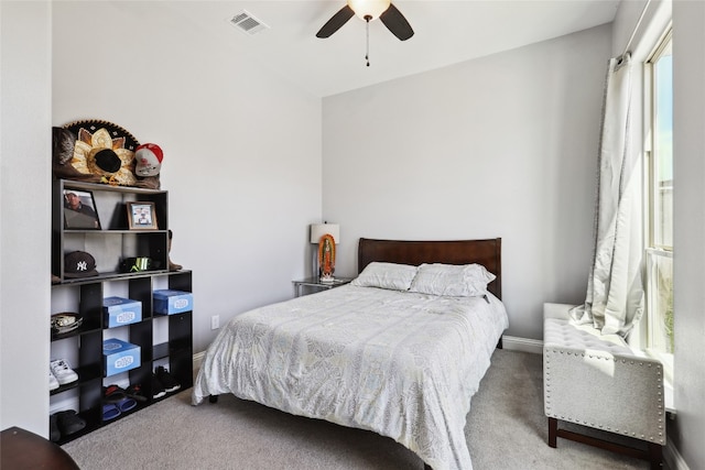 bedroom featuring ceiling fan and carpet