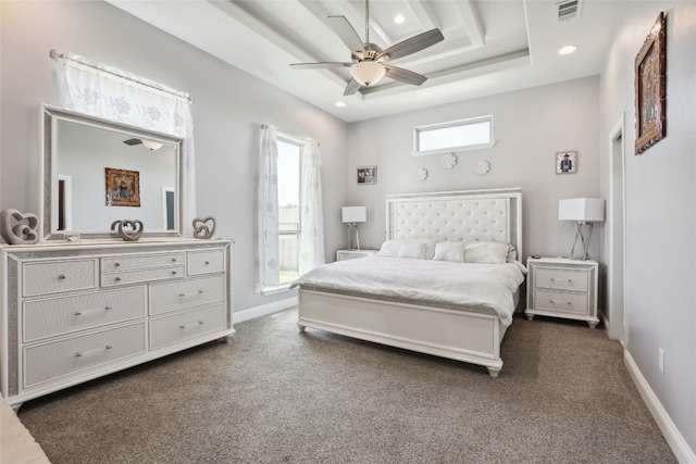 carpeted bedroom with multiple windows and ceiling fan