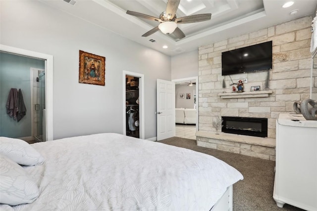 287 La Fortuna Dr, Del Valle, TX 78617 - bedroom with a fireplace, a spacious closet, carpet, recessed lighting, and ensuite bathroom