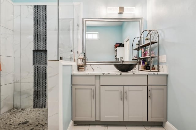 287 La Fortuna Dr, Del Valle, TX 78617 - bathroom featuring a shower stall, vanity, and baseboards