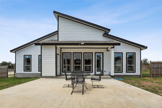 287 La Fortuna Dr, Del Valle, TX 78617 - rear view of house with a patio