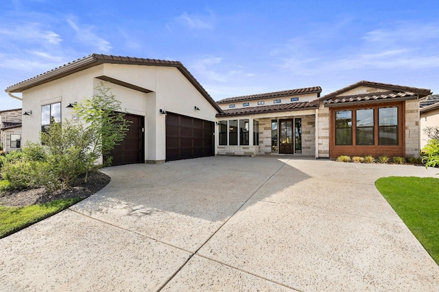 mediterranean / spanish-style house featuring a garage