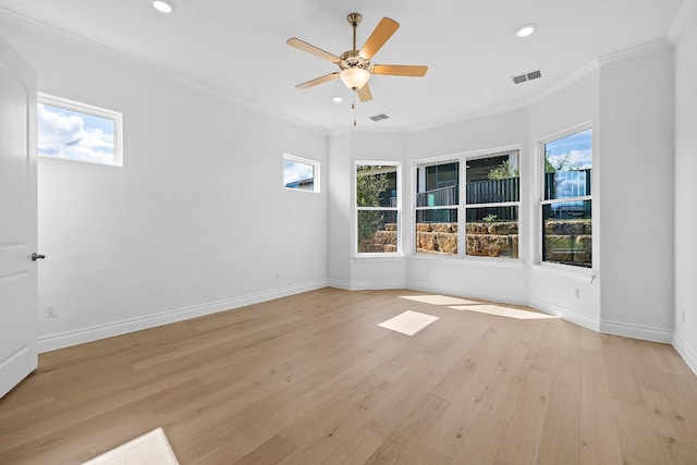 spare room with light hardwood / wood-style flooring, ceiling fan, and ornamental molding