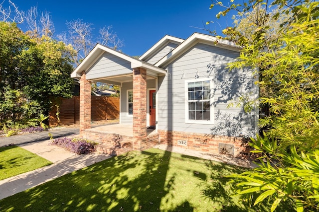 view of front of property with a front lawn